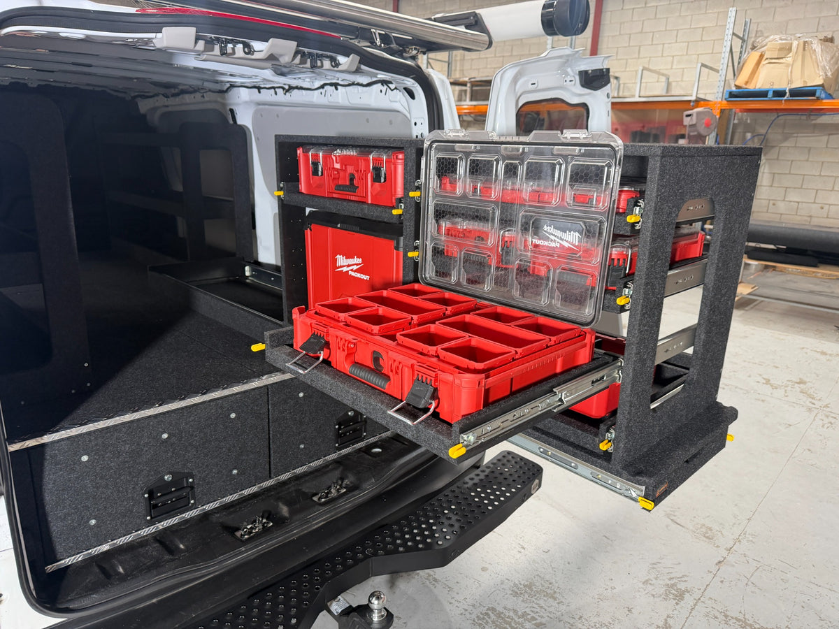 Open Milwaukee PACKOUT organiser on an extended Easy Access slide-out shelf above drawers in a Ford Transit Custom