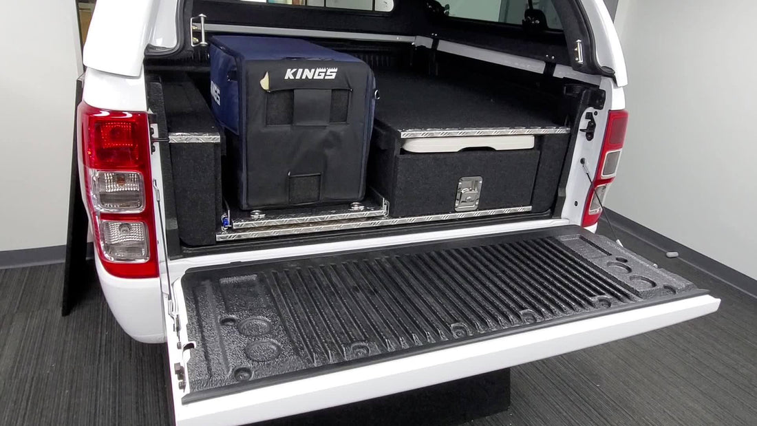 Earlier Lawson ute camping fit-out with a fridge slide beside a drawer and preparation table
