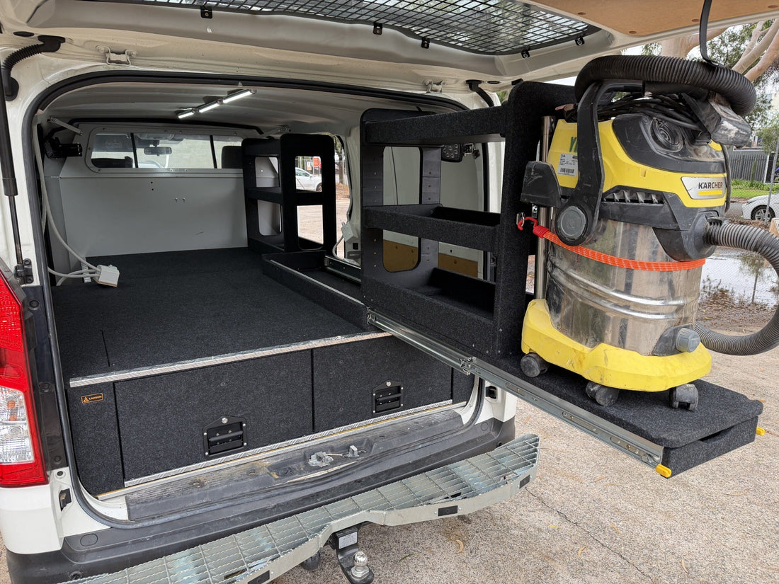 Rear view of a custom Toyota HiAce drawer system with Easy Access shelving slide and vacuum cleaner mount