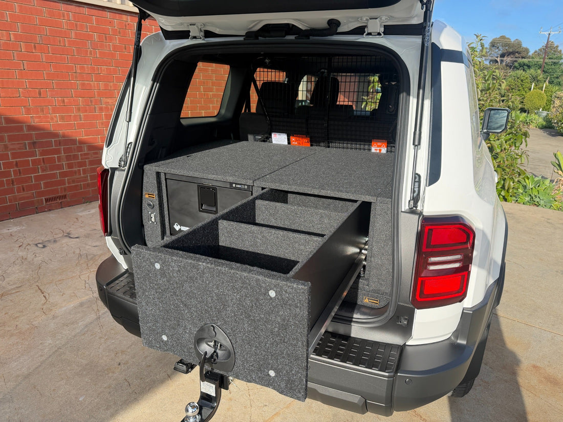 Prado 250 INFINITY storage drawer extended beside a Bushman 30-litre drawer fridge