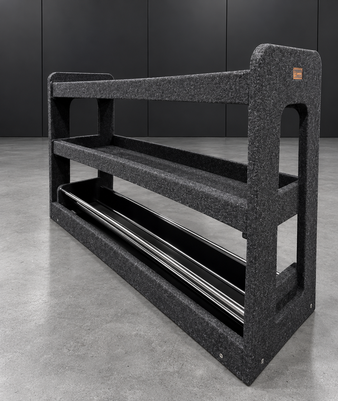 Standalone drawer top shelving bay with base cable holder on an industrial cement floor
