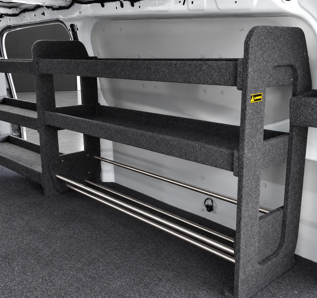 Drawer top shelving bay with base cable holder installed in a van