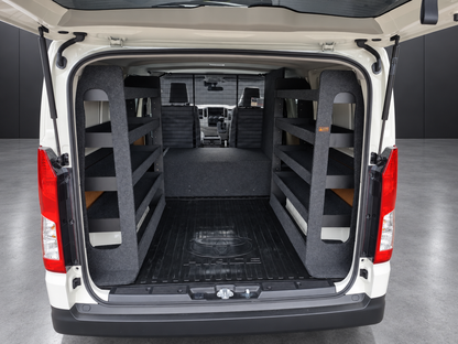 Two full-height shelving bays fitted over the rear wheel arches of a Toyota HiAce