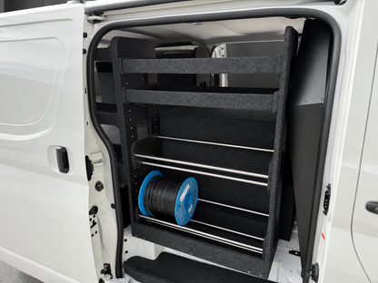 Full-height van shelving at the sliding door with two upper shelves and two rows of cable-roll holders