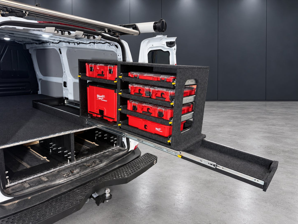 Milwaukee Easy Access System extended from the rear of a Ford Transit Custom, with mixed PACKOUT units and slim utility drawer open