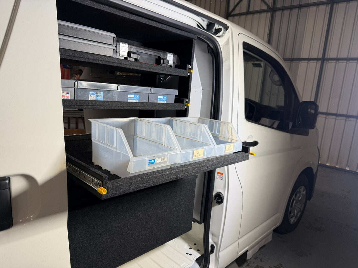 Access Side Door Shelving with storage bins on an extended shelf and tool cases in the shelving bay