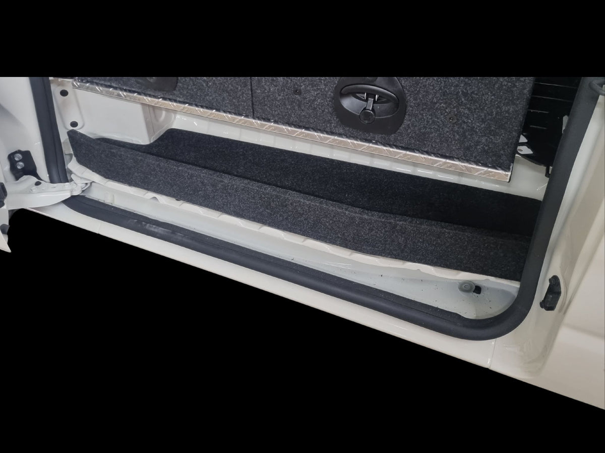 Carpet-lined Step Shelf fitted in the Toyota HiAce sliding-door step beneath the drawer system
