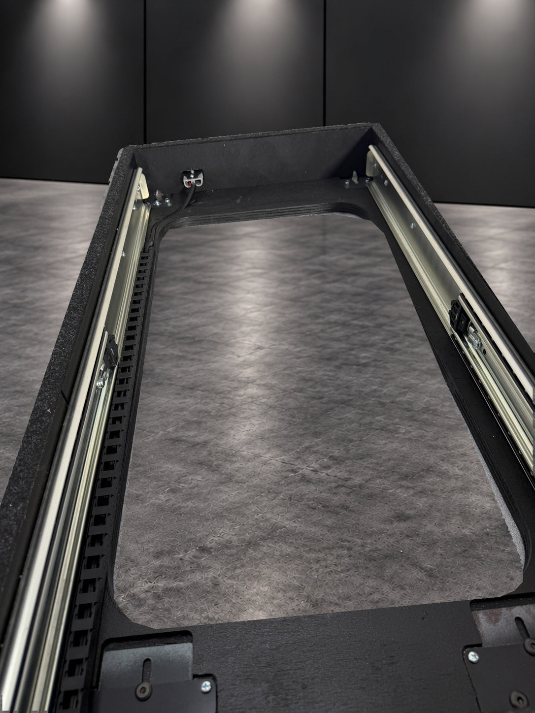 INFINITY High Deck Slide runner and cable caddy detail
