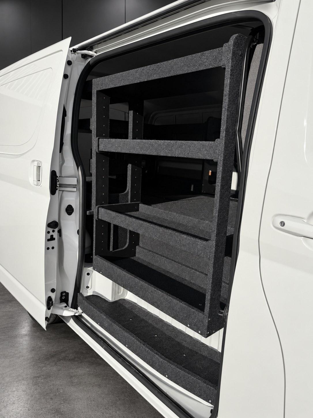Full-height shelving bay at a van sliding door